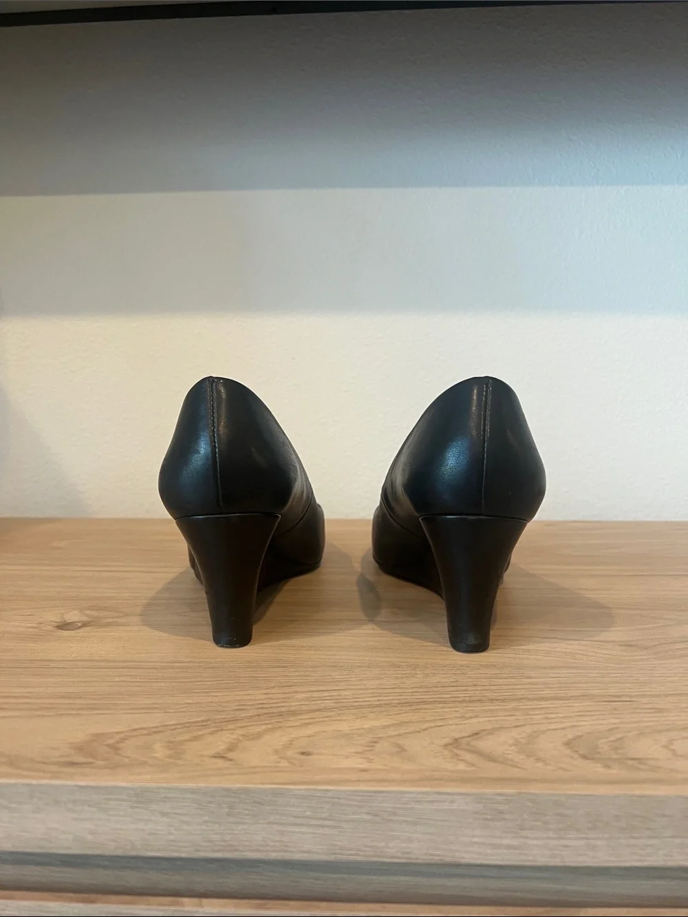 Tory Burch Black Leather Wedge Pumps with Gold Logo Medallion